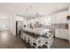Spacious kitchen with stainless steel appliances, granite countertops, and a large center island with seating at 6633 Penfield St, Wake Forest, NC 27587