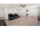 Bright living room with neutral walls, ceiling fan, and view of doorways leading to other spaces at 6633 Penfield St, Wake Forest, NC 27587