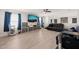 Comfortable living room featuring modern furniture, large TV, and open floor plan at 6633 Penfield St, Wake Forest, NC 27587