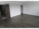 Spacious bedroom with hardwood floors and access to the ensuite bathroom at 6633 Penfield St, Wake Forest, NC 27587
