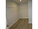 Large walk-in closet with laminate floors and wire shelving at 6633 Penfield St, Wake Forest, NC 27587
