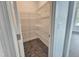 A large walk-in pantry features vinyl flooring and wire shelving at 6633 Penfield St, Wake Forest, NC 27587