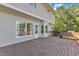 Large wooden deck with a bench, accessible from the house through a glass door at 7 Bonham Ct, Durham, NC 27703