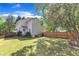 Spacious backyard with a well-maintained lawn and a privacy fence at 7 Bonham Ct, Durham, NC 27703