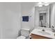 Well-lit bathroom features a single sink vanity, a large mirror and a linen closet at 7 Bonham Ct, Durham, NC 27703