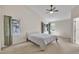 Cozy bedroom featuring a large window, vaulted ceiling, and an ensuite bathroom at 7 Bonham Ct, Durham, NC 27703