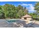 Community pool with lounge chairs and a pool house providing a relaxing atmosphere at 7 Bonham Ct, Durham, NC 27703
