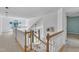 Open landing area with white railings leads to the upper floor bedrooms at 7 Bonham Ct, Durham, NC 27703