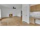 Inviting living room with hardwood floors, fireplace and a built-in desk area at 7 Bonham Ct, Durham, NC 27703