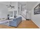 Bright and spacious living room with hardwood floors, high ceilings, staircase, and a comfortable seating area at 7 Bonham Ct, Durham, NC 27703