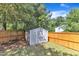 Outdoor storage shed surrounded by a wooden privacy fence at 7 Bonham Ct, Durham, NC 27703