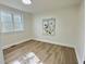 Bright, empty bedroom with natural light and lovely wood floors at 707 Wade Ave, Raleigh, NC 27605