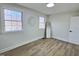 Inviting bedroom with two windows, wood flooring, and light walls at 707 Wade Ave, Raleigh, NC 27605