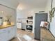 Modern kitchen features stainless steel appliances, white cabinetry, and butcher block countertops at 707 Wade Ave, Raleigh, NC 27605