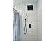 Updated shower with black fixtures and white subway tile at 707 Wade Ave, Raleigh, NC 27605