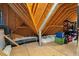 View of unfinished attic space with exposed beams and insulation at 712 Evanvale Ct, Cary, NC 27518
