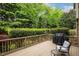 Inviting back deck with a grill and comfortable seating, perfect for outdoor relaxation at 712 Evanvale Ct, Cary, NC 27518