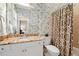 The bathroom features a granite vanity, decorative wallpaper, and a shower with patterned curtain at 712 Evanvale Ct, Cary, NC 27518