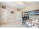 Bright bedroom with bunkbeds and carpet at 712 Evanvale Ct, Cary, NC 27518