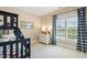 Bright bedroom with bunk beds, soft carpet, and large window with nice curtains at 712 Evanvale Ct, Cary, NC 27518