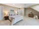 Comfortable bedroom featuring neutral tones, plush carpet, and an ensuite bathroom view at 712 Evanvale Ct, Cary, NC 27518