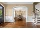 Formal dining room with chandelier, wainscoting, and hardwood floors, perfect for entertaining at 712 Evanvale Ct, Cary, NC 27518