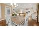 Spacious open concept dining room flows into the kitchen and living areas creating a seamless entertainment space at 712 Evanvale Ct, Cary, NC 27518