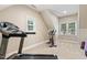 Exercise room featuring fitness equipment and windows at 712 Evanvale Ct, Cary, NC 27518