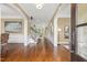 Inviting foyer with hardwood floors, elegant moldings, and open view to living spaces at 712 Evanvale Ct, Cary, NC 27518