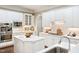 Bright kitchen features custom cabinets, stainless steel appliances, and a spacious center island at 712 Evanvale Ct, Cary, NC 27518