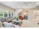 Living room with seating area, ceiling fan, and window views at 712 Evanvale Ct, Cary, NC 27518