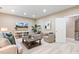 Living room with TV, two chairs, and a large area rug at 712 Evanvale Ct, Cary, NC 27518