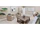 Living room with neutral walls, plenty of light, and a large area rug at 712 Evanvale Ct, Cary, NC 27518