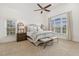 The main bedroom features vaulted ceilings, large windows, and a seating area with upholstered benches at 712 Evanvale Ct, Cary, NC 27518