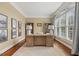 Bright office with a large window, built-in bookshelves, and a wood desk at 712 Evanvale Ct, Cary, NC 27518