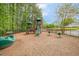 Community playground with slides and various play structures, perfect for Gathering fun at 712 Evanvale Ct, Cary, NC 27518