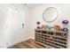 Inviting entryway with a shoe rack, modern decor, and hardwood-style floors at 729 Little Patch St, Zebulon, NC 27597