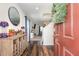 Welcoming foyer with beautiful wood flooring and a view into the living area, creating a warm and inviting atmosphere at 729 Little Patch St, Zebulon, NC 27597
