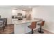 Modern kitchen with granite countertops, stainless steel appliances, and a breakfast bar, ideal for casual dining and food preparation at 729 Little Patch St, Zebulon, NC 27597