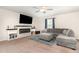 Comfortable living room with a modern fireplace, stylish decor, and a relaxing atmosphere for entertainment and relaxation at 729 Little Patch St, Zebulon, NC 27597