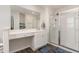Elegant main bathroom with glass-enclosed shower and extended vanity at 729 Little Patch St, Zebulon, NC 27597