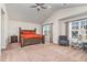 Spacious main bedroom with vaulted ceiling, large windows and stylish decor at 729 Little Patch St, Zebulon, NC 27597