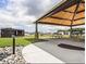 Community pavilion featuring picnic tables, stone pillars, and BBQ grills surrounded by a green lawn at 729 Little Patch St, Zebulon, NC 27597