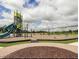 Community playground featuring a slide, swings, and other playground equipment at 729 Little Patch St, Zebulon, NC 27597