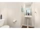 Cozy powder room with pedestal sink, and stylish fixtures at 729 Little Patch St, Zebulon, NC 27597