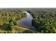 Aerial view of a beautiful lake surrounded by lush greenery and trees at 7401 Ray Rd, Raleigh, NC 27613