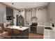 Modern kitchen with stainless steel appliances, a large island, and stylish pendant lighting at 7401 Ray Rd, Raleigh, NC 27613