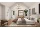 Bright main bedroom featuring vaulted ceiling, chandelier, and ensuite bathroom access at 7401 Ray Rd, Raleigh, NC 27613
