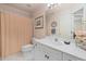 Clean bathroom with a white vanity, shower curtain, and tiled floor at 7508 Venture Ct, Raleigh, NC 27615