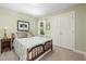 Cozy bedroom featuring a double bed, closet, and view from the window at 7508 Venture Ct, Raleigh, NC 27615